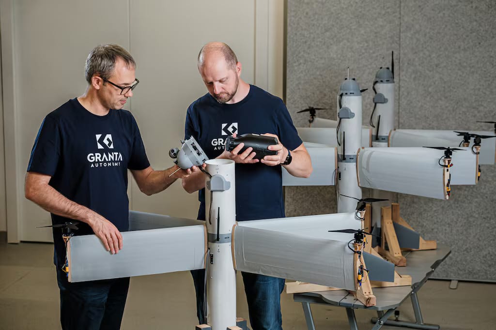 Granta Autonomy employees work on the X-Wing Loitering Munition. (Granta Autonomy)